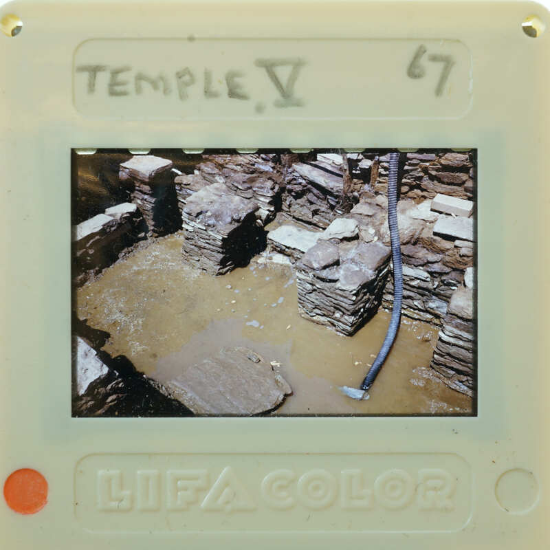 Stone wall structure with flooded interior floors.