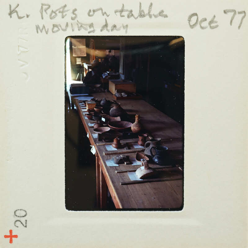 A table with a variety of pottery and clay items on it.