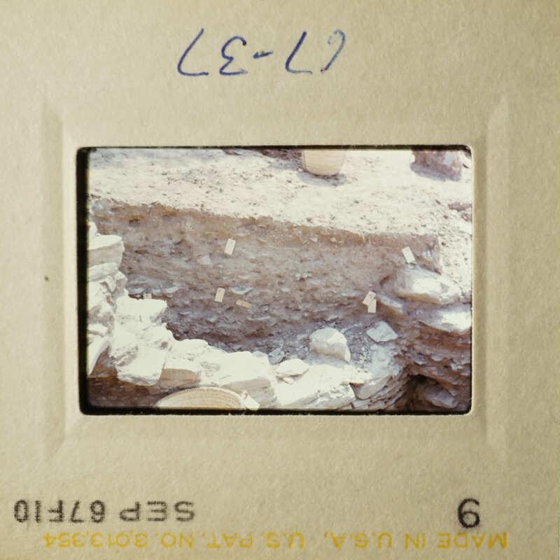 Two vintage photos showing excavation sites with exposed earth and rocks, likely from an archaeological dig.