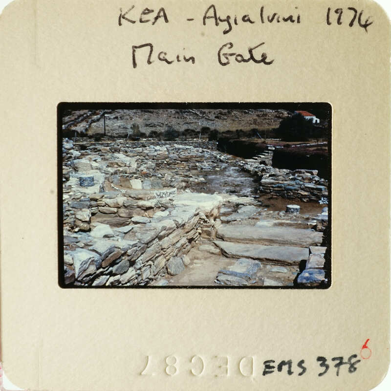 A photograph of an ancient archaeological site with stone ruins and vegetation.