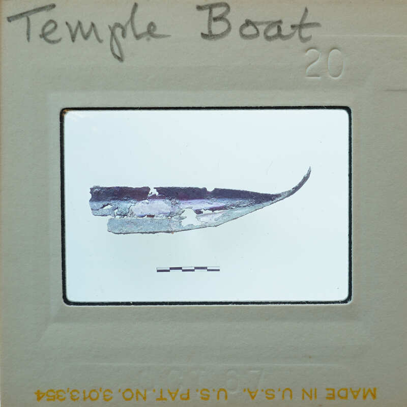 Small metal fragment of what looks to be the hull of a boat.