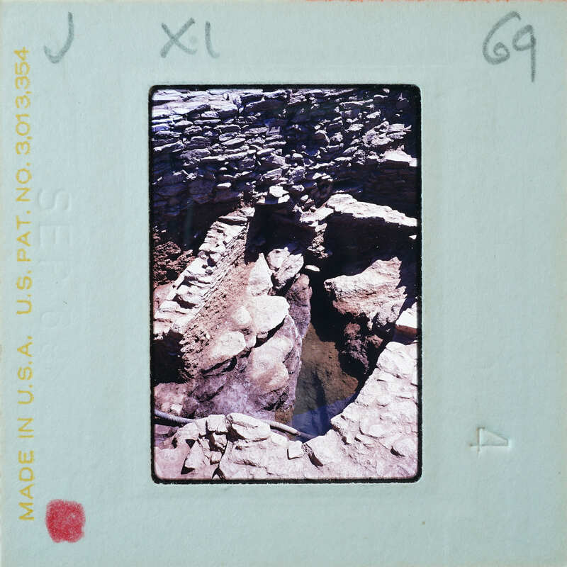 Excavated stone walls and modern drainage system.