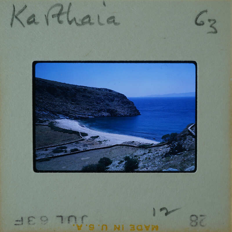 A vintage photo of a coastal landscape with a sandy beach and blue water, labeled "Katharina" on the bottom left corner.