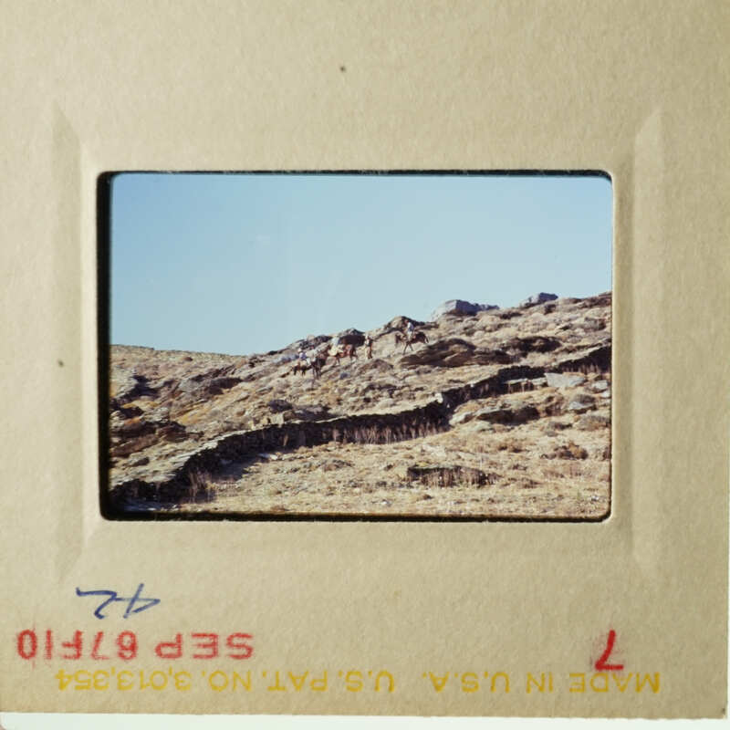 This is an image of a landscape scene, possibly a desert or mountainous area, captured on a slide.