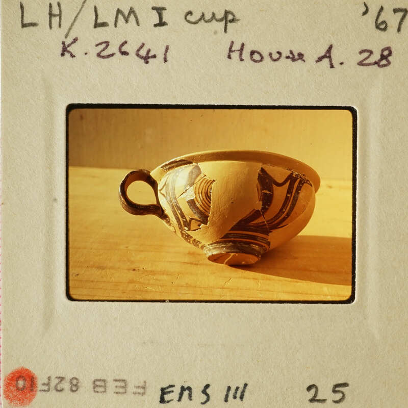 Ancient Greek vase with black and red designs.