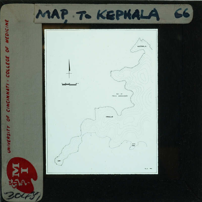 Map of Kepala, with a cross marking a specific location and labeled features like mountains and bodies of water.