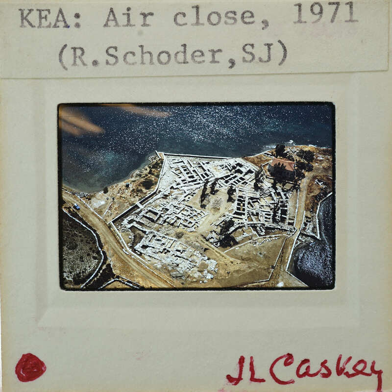 Aerial photograph of a fortified island with buildings and structures, taken in 1971 by R. Schroeder, SJ.