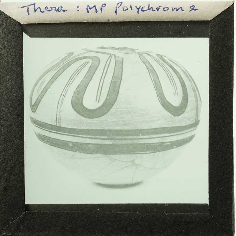 Ancient ceramic pot with decorative patterns on display.