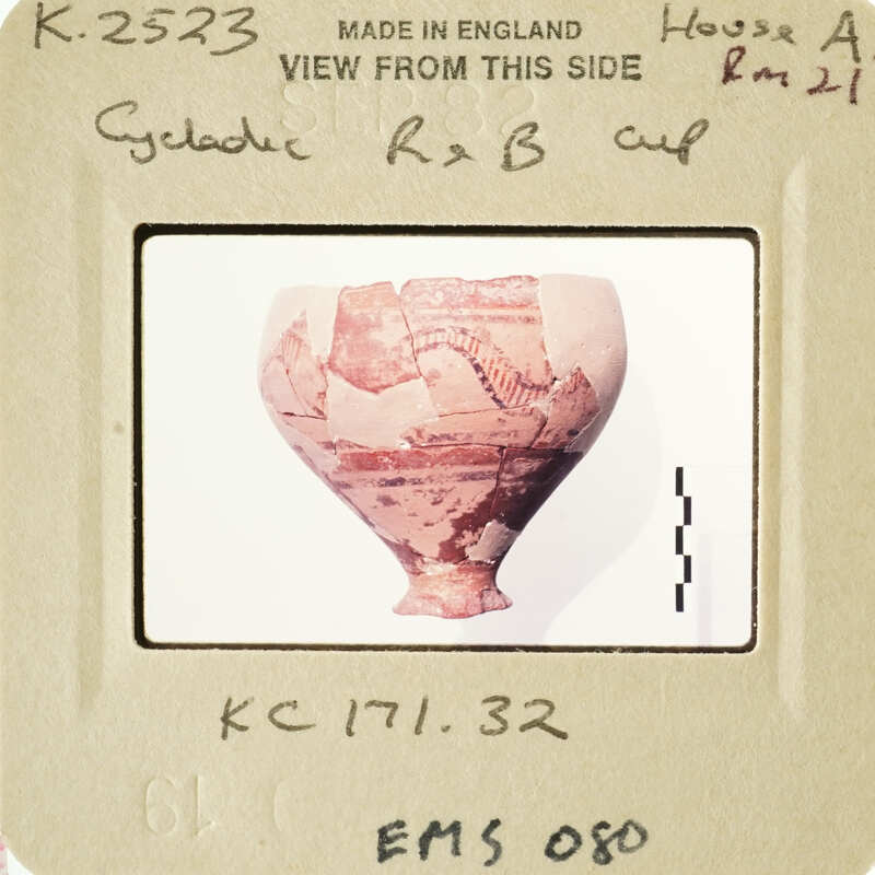 Ancient Greek vase with visible cracks and chips, displayed against a white background.