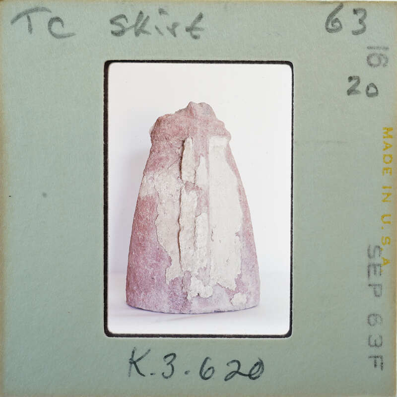 Terracotta figurine detail showing skirt from the back.