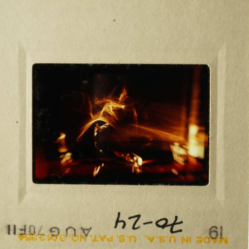 Two photos showing a single slide with a candlelit scene, likely from a presentation or lecture.