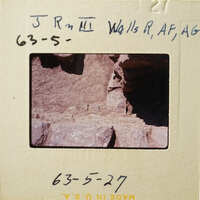 Rocky cliff with layers and crevices, photographed on film, dated May 27, 1963.