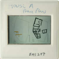 "Aerial map with handwritten notes on a transparent surface."