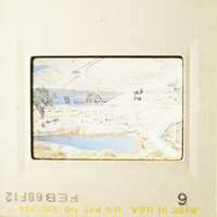 This is a photo of a scenic landscape with water and mountains visible.