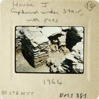 Old photograph of ruins with handwritten notes on the border, dated 1964.