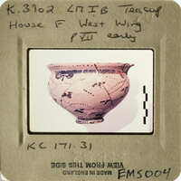 Ancient Greek vase with black and red figures on display.