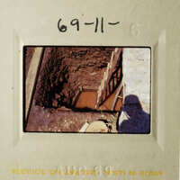 The image shows an underground tunnel with water, and there's a wooden ladder leading down into it.