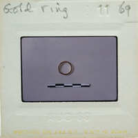 A ring on a piece of paper with writing and numbers around it.