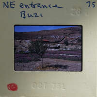 A vintage film strip with a photograph of a scenic landscape, possibly from the 1970s.