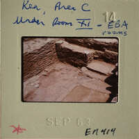 Old photo of stone ruins with handwritten notes on the back.