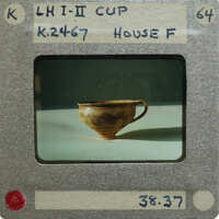 Cup (K.2467) in profile on white surface.