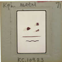 Four metal objects on white background with scalebar.