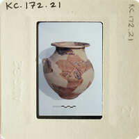 Ancient vase with intricate designs on display.