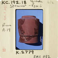 Ancient clay pot with visible cracks and imperfections.