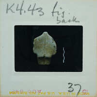 Marble figurine torso from the back.