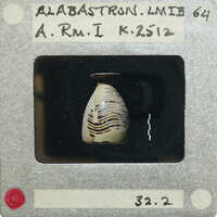 A photograph of an alabastron vase (K.2512) in profile.