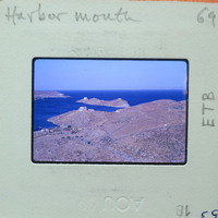 A vintage photograph of a coastal landscape with islands, water, and land features.