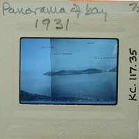 A vintage panoramic photo of a bay with a label and date from 1973.