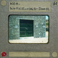 Picture of a door with a vintage look, framed by an old film strip.