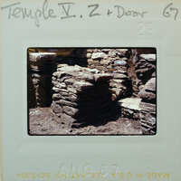 Stone structure with doorway and threshold.