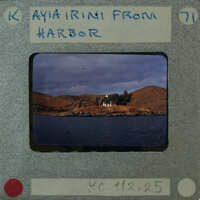 Picture of a harbor with a house on an island.