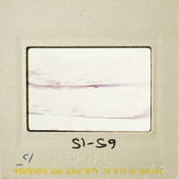 Close-up photograph of a pottery break surface on a film strip.