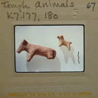 Two ancient ceramic animal figurines on display, K7.177, K7.180