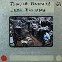 A slide of an archaeological site with ruins and workers, labeled as "Temple Room VI."