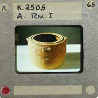 Reassembled clay pot (K.2505) with a broken handle.