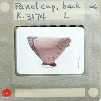 A panel cup (K.3174) with intricate patterns on display..