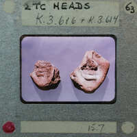 Two terracotta figurine face fragments from front showing chins and lips K3.616, K3.614.