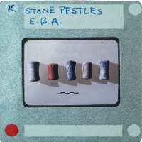 Five cylindrical stone pestles of various colors.