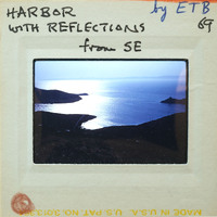 Serene harbor scene with coast and water.