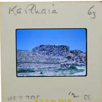 A slide of a rocky landscape with a handwritten name on the border.