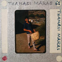 A man standing outside holding a basket.