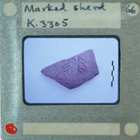 A photograph of a stone with an engraved design, displayed on a film strip card labeled "K.3805".