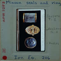 Ancient Greek rings displayed on a museum card with labels and descriptions.