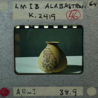Ancient ceramic vase with intricate designs on display, K.2419.