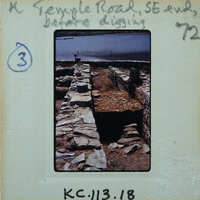 Parallel stone walls with surface between them.