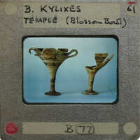 Partially reassembled kylixes in profile.